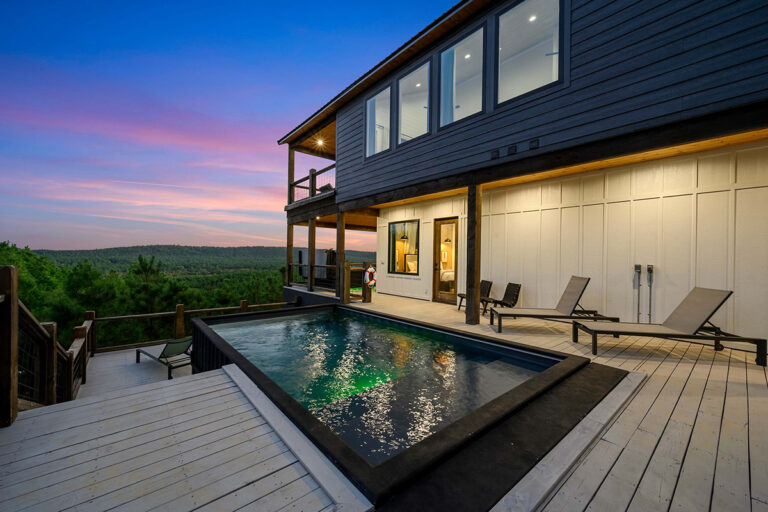 Outdoor heated pool at luxury cabin rental in broken bow.