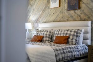 Cozy looking bed inside the poolside pines broken bow cabin from mountain forks