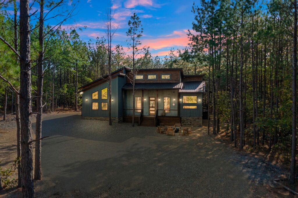 Front view of the float on luxury cabin with private pool and modern rustic design near mountain fork river
