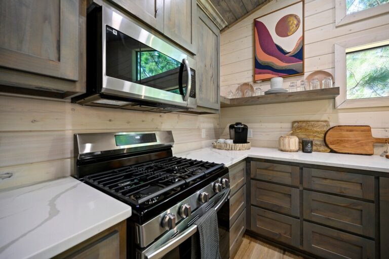 Modern cabin kitchen with stainless steel appliances, perfect for a couple's getaway