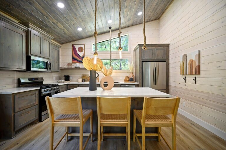 Rustic-modern kitchen with island seating, ideal for a couple's getaway