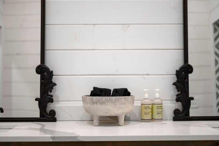 Elegant bathroom vanity with decorative bowl and hand soap, ideal for a couple's getaway