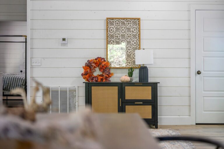 Entryway with decorative console table and seasonal accents, ideal for a couple's getaway