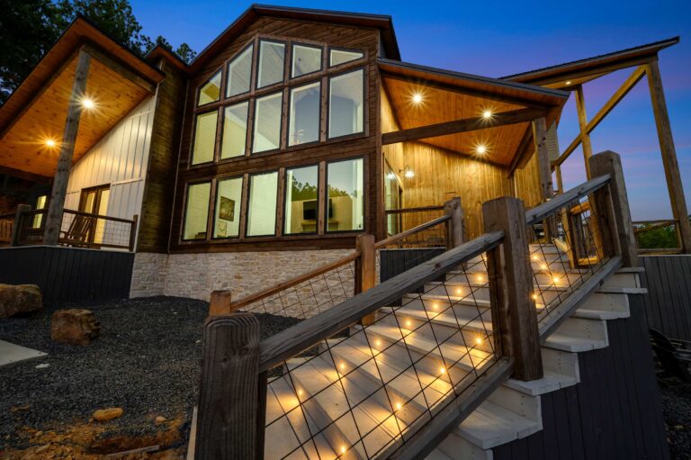 Modern luxury cabin with illuminated stairs—perfect for a large family vacation