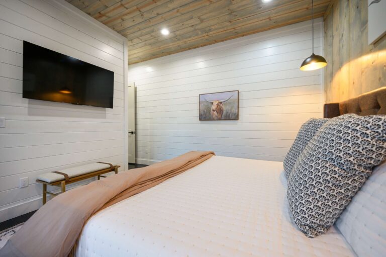 Modern bedroom with cozy bedding—ideal for a large family vacation stay