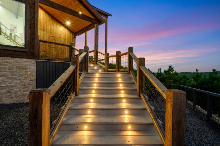 Illuminated wooden staircase leading to a cabin—perfect for a large family vacation