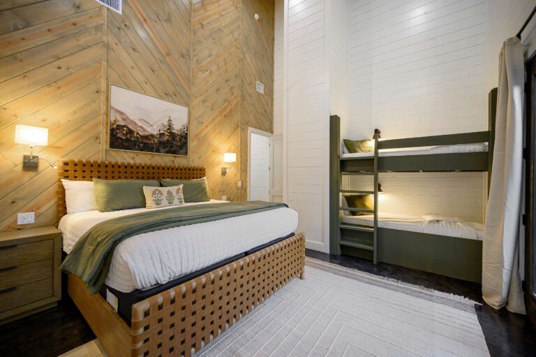 Spacious bedroom with king bed and bunk beds for a large family vacation