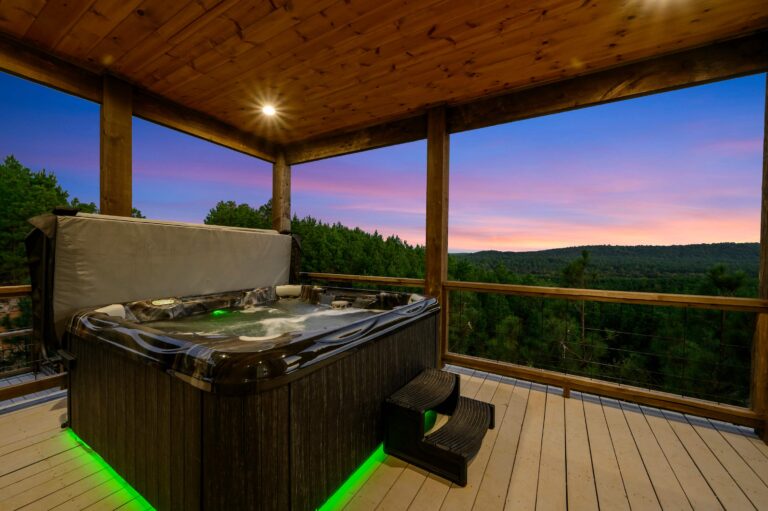 Hot tub with forest views at sunset, ideal for a large family vacation