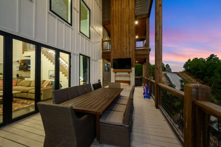 Spacious outdoor dining area with fireplace for a large family vacation