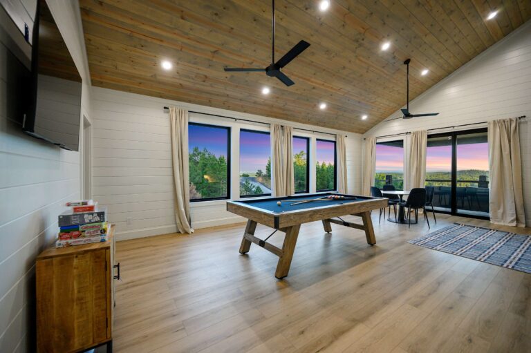 Game room with pool table and board games for large family vacation fun