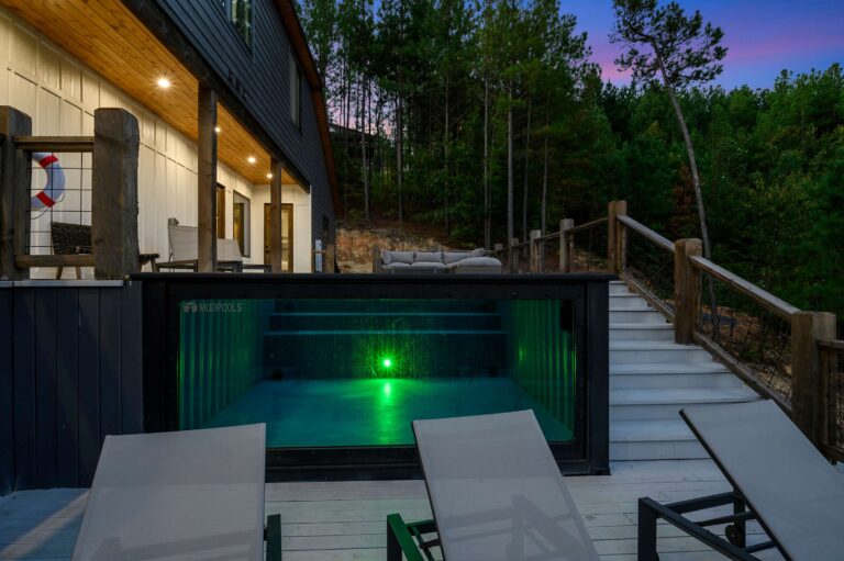 Private pool with glowing green light, perfect for large family vacation relaxation