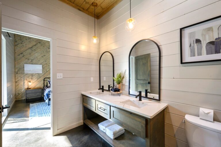 Modern bathroom with double sinks for a family reunion rental home.