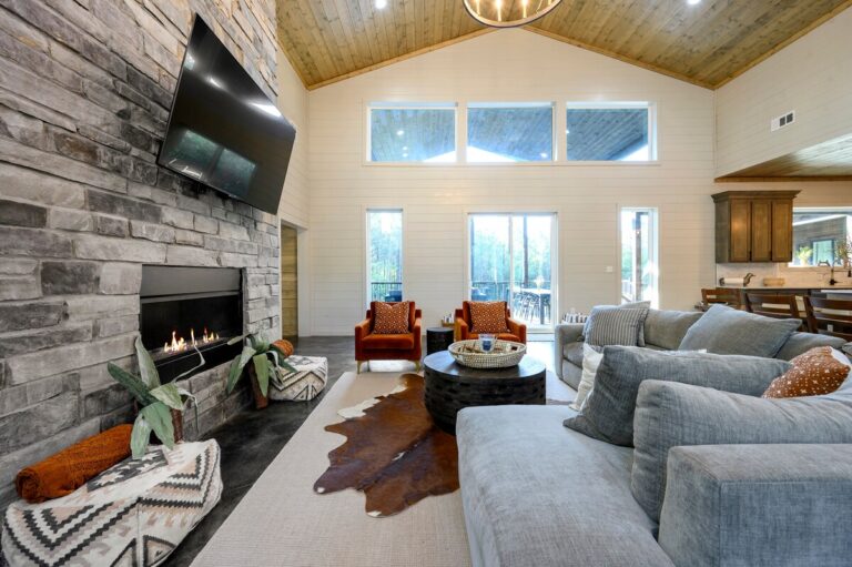 Living room with bright windows and ample seating for a family reunion.