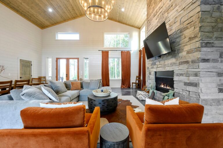 Cozy living room with fireplace for a family reunion gathering space.