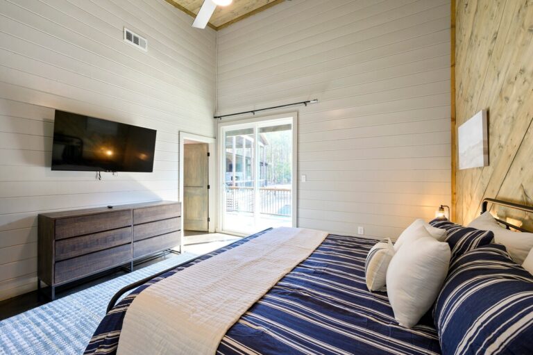 Large extended family group smiling at a reunion outdoors, with adults and children gathered in a park setting — family reunion