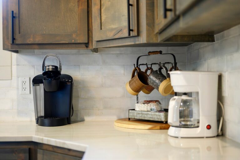 Coffee station with Keurig, drip brewer, and hanging mugs — family reunion kitchen setup