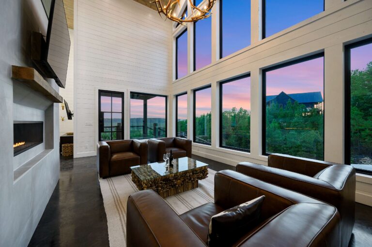 Spacious living room with sunset views and cozy seating for a large family vacation