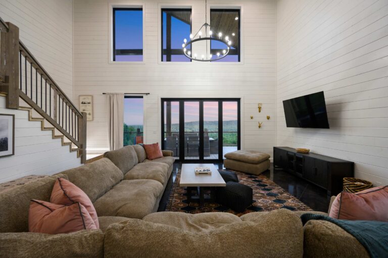 Main living room with spacious sectional seating for a large family vacation