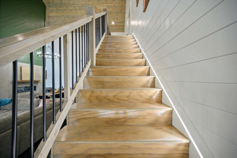 Interior wooden staircase in a luxury cabin for large family vacation