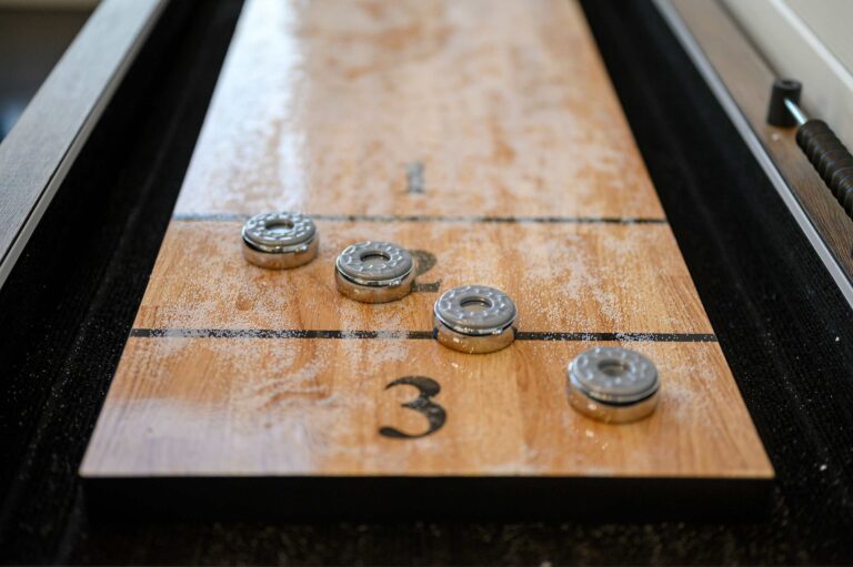 Close-up of shuffleboard table in luxury cabin for large family vacation