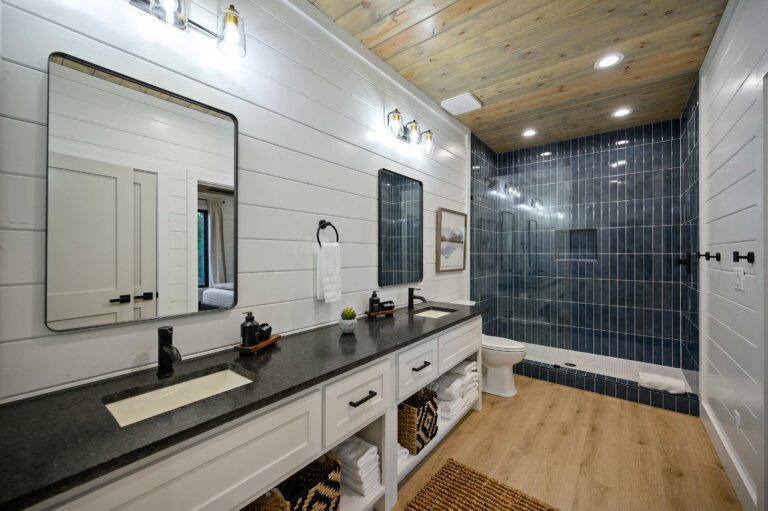 Spacious bathroom with dual sinks and large walk-in shower for family convenience