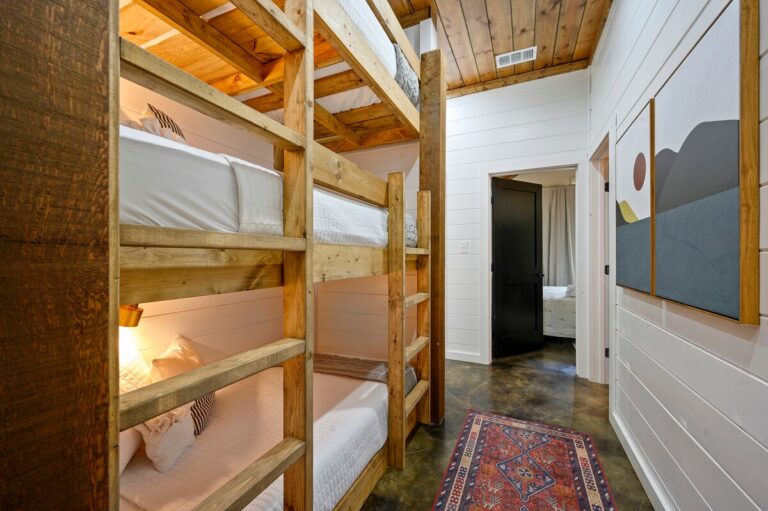 Splish Splash cabin bunk bed hallway for family vacation ideas, sleeping after river activities, and fun ways to experience nature indoors.
