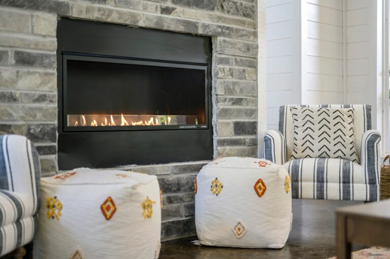 Splish Splash cabin fireplace close-up for family vacation ideas, cozy nights after river activities, and ways to experience nature indoors.