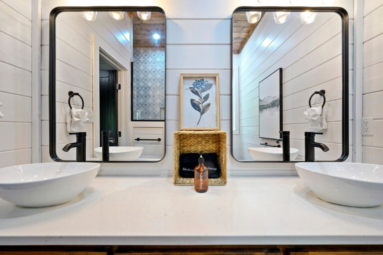 Double sink bathroom at Splish Splash cabin for family vacation ideas, relaxing after river activities, and ways to experience nature.