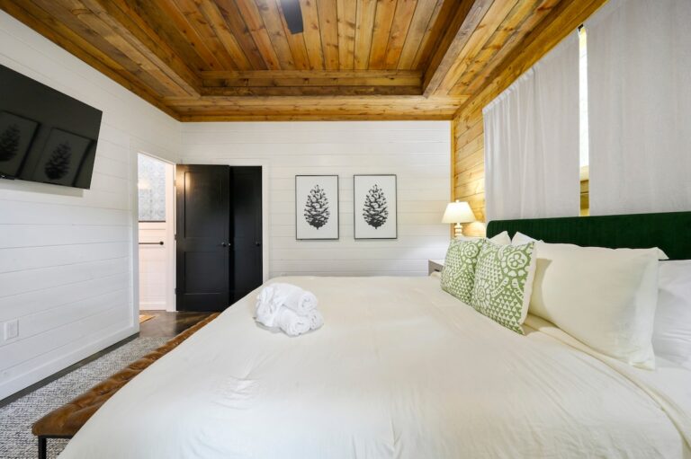 Spacious bedroom at Splish Splash cabin for family vacation ideas, peaceful sleep after river activities, and chances to experience nature.