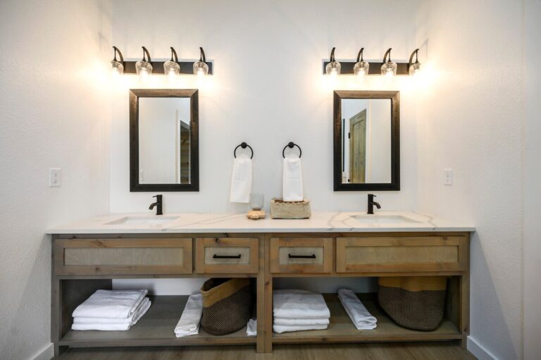 Double vanity with rustic wood design in Sky Dive pet friendly cabin, ideal for families enjoying stargazing and evenings by the outdoor fire pit.