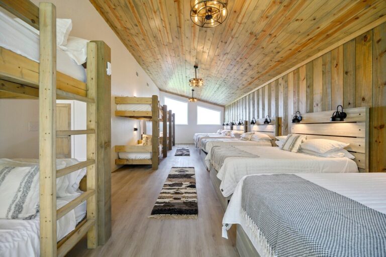 Alternate view of bunk room at Sky Dive cabin with wooden bunk beds, designed for stargazing getaways with family and friends.