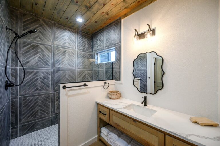 Black tile chevron shower in bathroom for stargazing cabin luxury