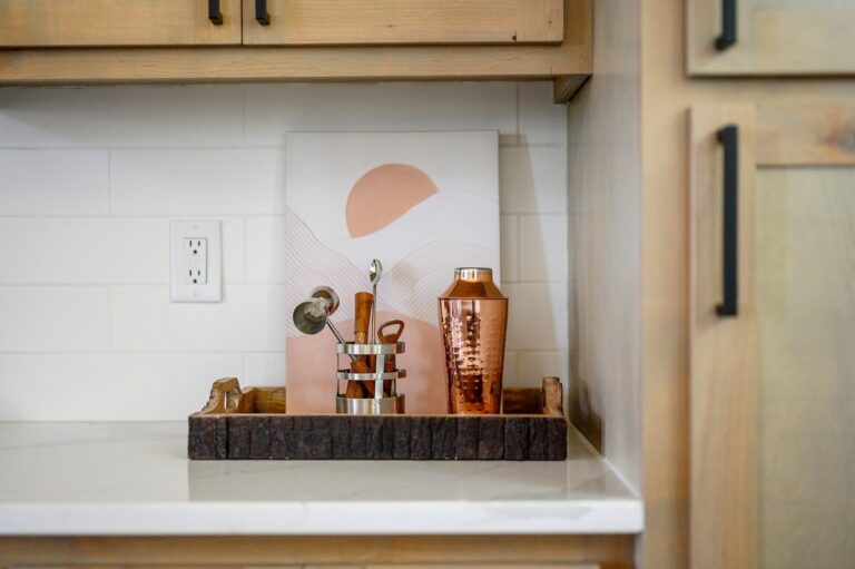 Copper bar set displayed in Sky Dive pet friendly cabin, creating a stylish corner for gatherings after stargazing by the outdoor fire pit.