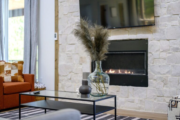 Cozy stone fireplace in a pet friendly cabin for stargazing and outdoor fire pit evenings