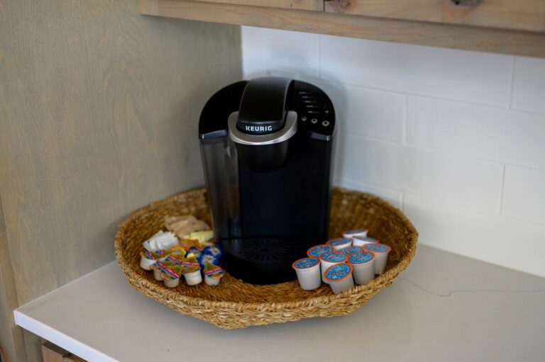 Keurig coffee station with K-cups inside Sky Dive pet friendly cabin, ideal for mornings after stargazing nights by the outdoor fire pit.