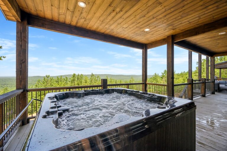 Hot tub with forest view at a pet friendly cabin for stargazing and outdoor fire pit relaxation