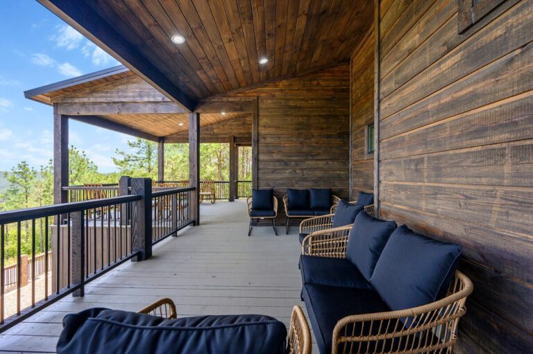 Cozy covered deck with lounge seating designed for stargazing.