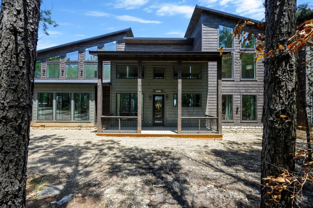 Modern pet friendly cabin exterior for stargazing vacations with an outdoor fire pit