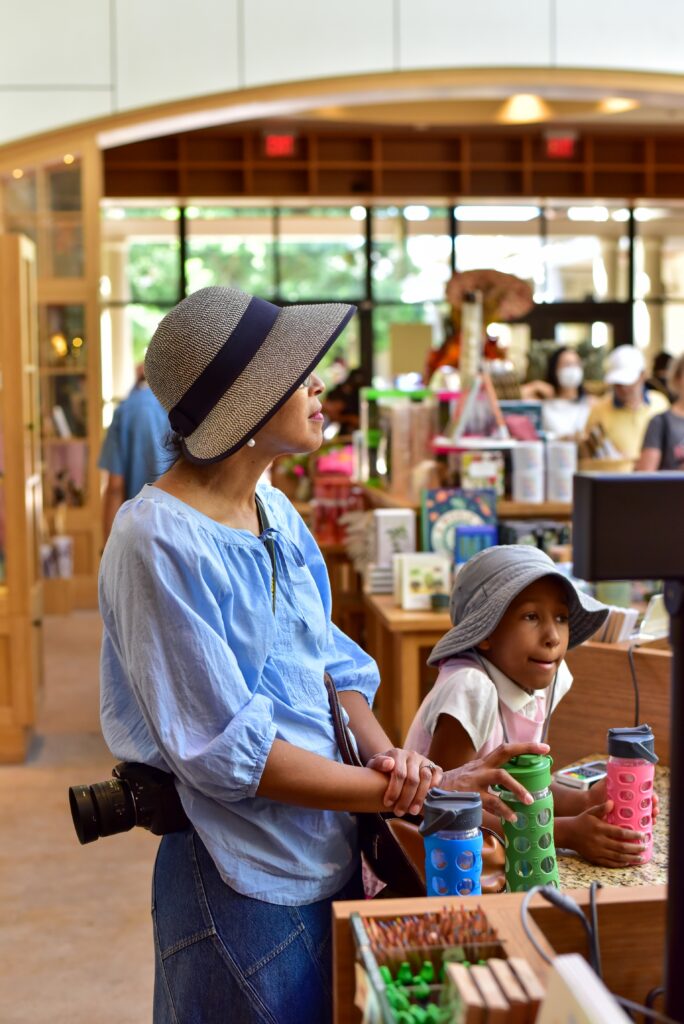 A family shopping at a local store near a cabin in beavers bend, enjoying a relaxed beavers bend vacation experience.