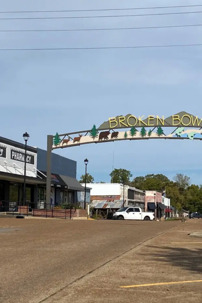 Downtown broken bow welcome arch and shops near popular broken bow cabins in southeastern oklahoma.
