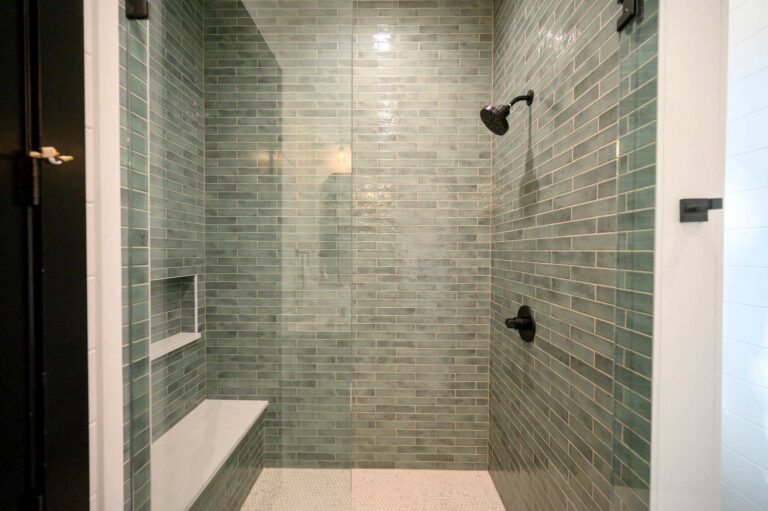 Modern walk-in shower inside Blue Note Broken Bow cabin with stylish tile walls and luxury cabin bathroom design.